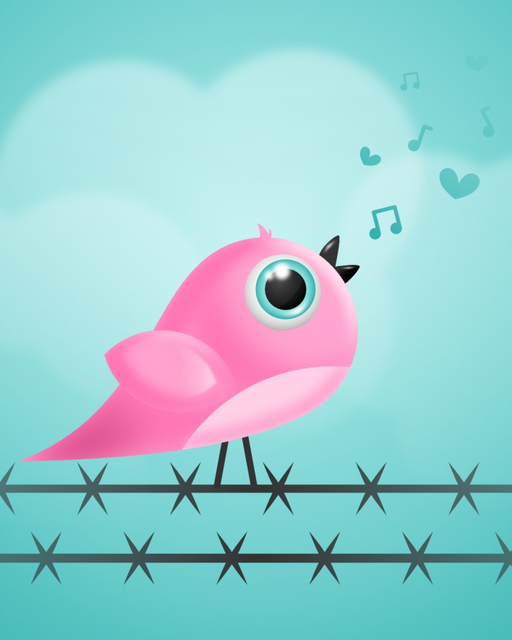 Close up of a pink bird sitting on a wire
